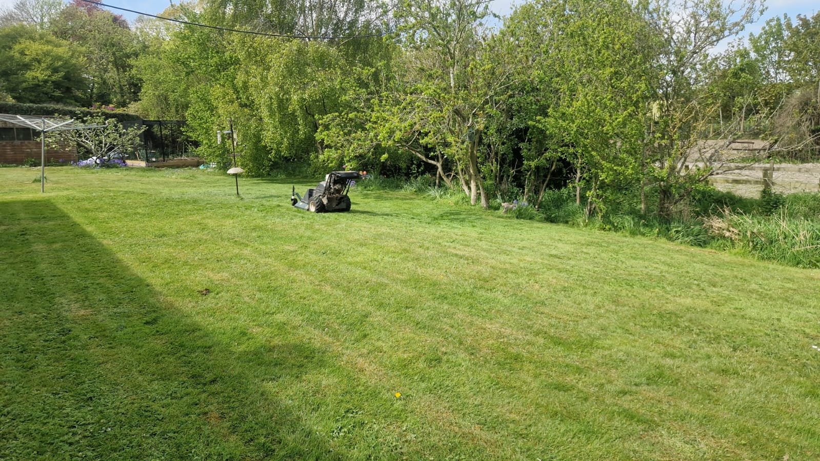 Kent Mowing ride-on mower cutting a large residential garden in Sandwich, CT13